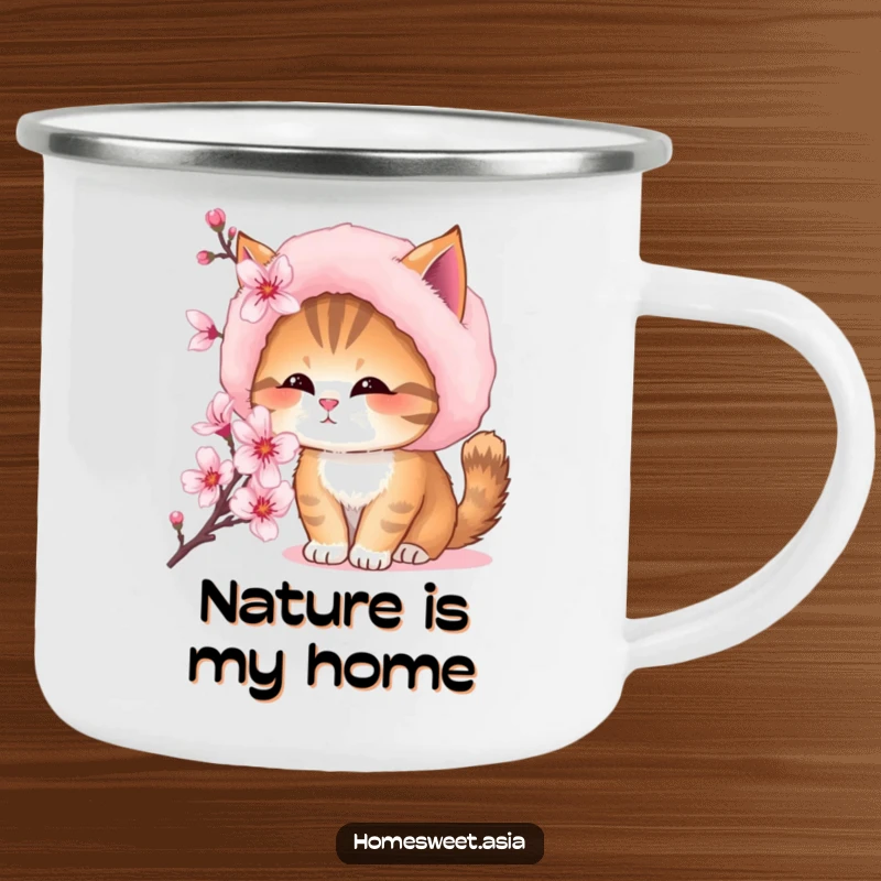 Funny camping mug showcasing a cat with a fur hat, sniffing a blooming cherry blossom during an outdoor adventure.