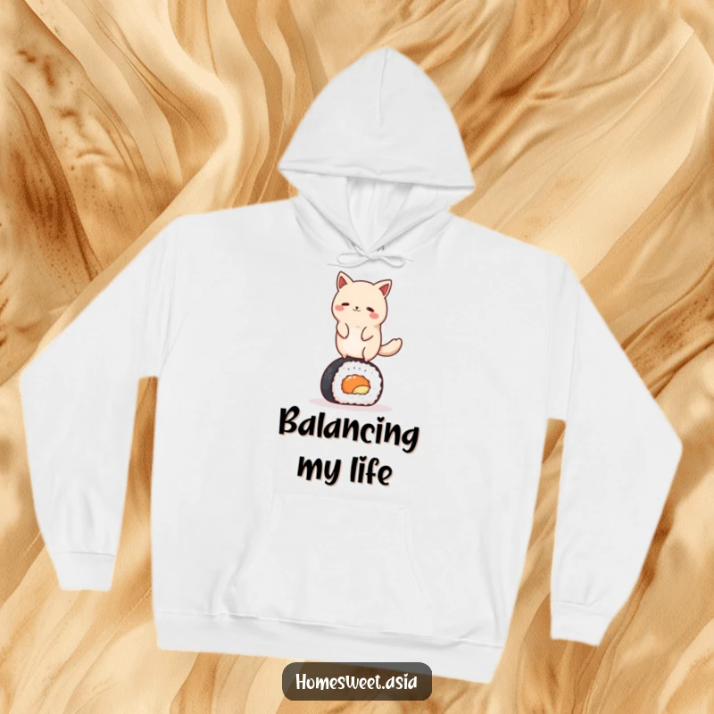 Funny round animal character gracefully balancing on a sushi roll, featured on a soft and warm hoodie. Whimsical and cozy apparel.