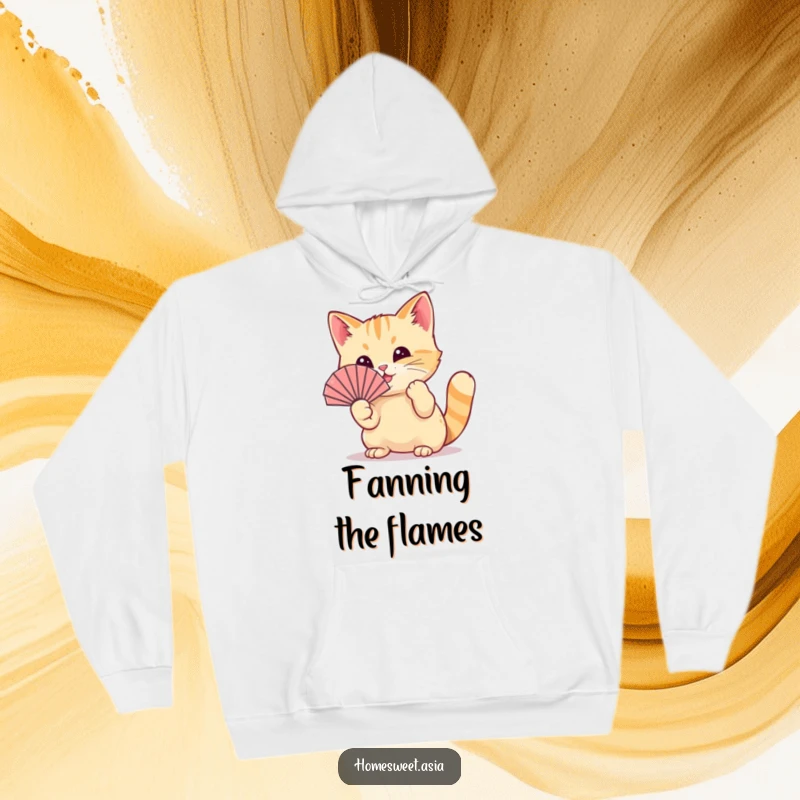 Funny cat wearing a tiny fan, playfully waving it with its paw, warm hoodie, comfortable, playful design, funny gift.