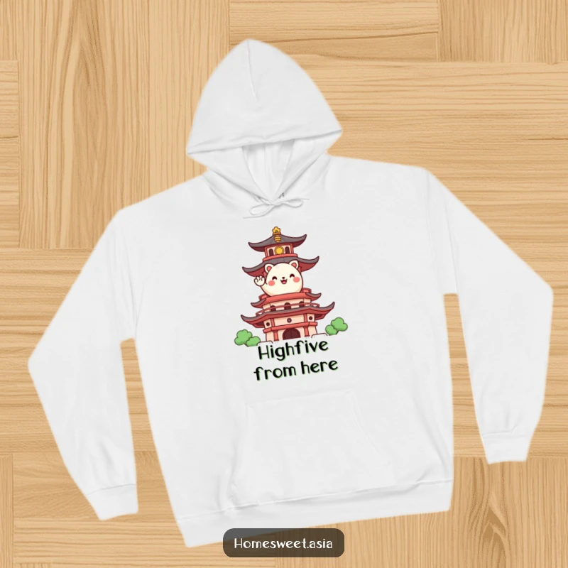 Funny hoodie print of a happy, round animal character waving from a stylized pagoda, offering cozy cultural cheer.